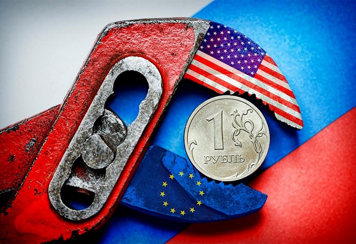 Wrench squeezing Russian Ruble between US and EU flags