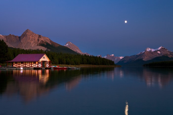 Boathouse on Maligne Lake with Mountains and Moon