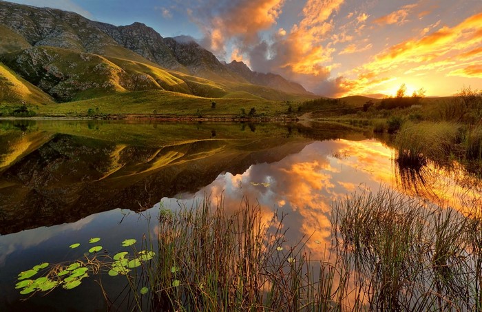 Mountains reflected in a lake at sunset