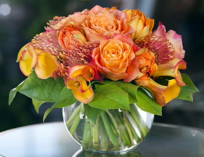 Orange Roses and Calla Lilies in a Glass Vase