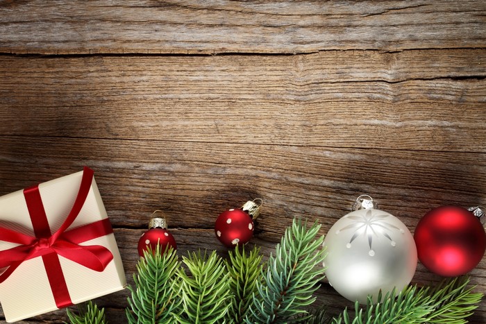 Christmas Gift and Ornaments on Wooden Background