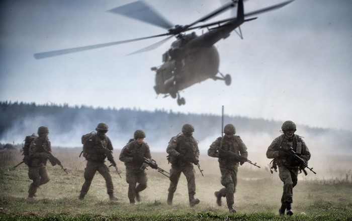 Soldiers in a landing operation with a helicopter