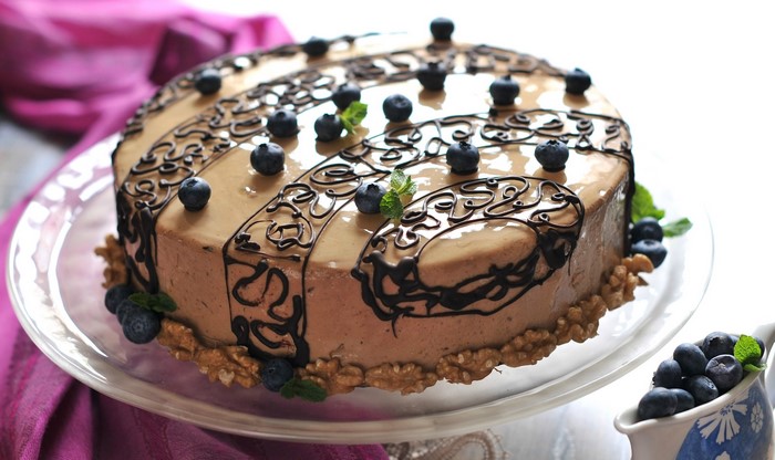 Chocolate cake with blueberries and walnuts