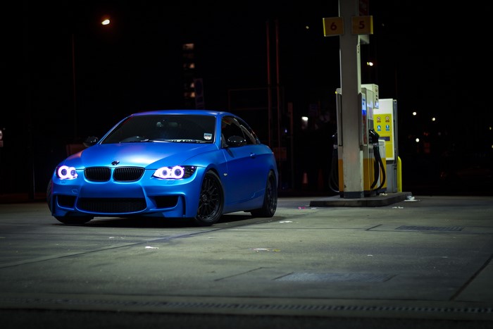 Blue BMW 335i E93 at a gas station at night