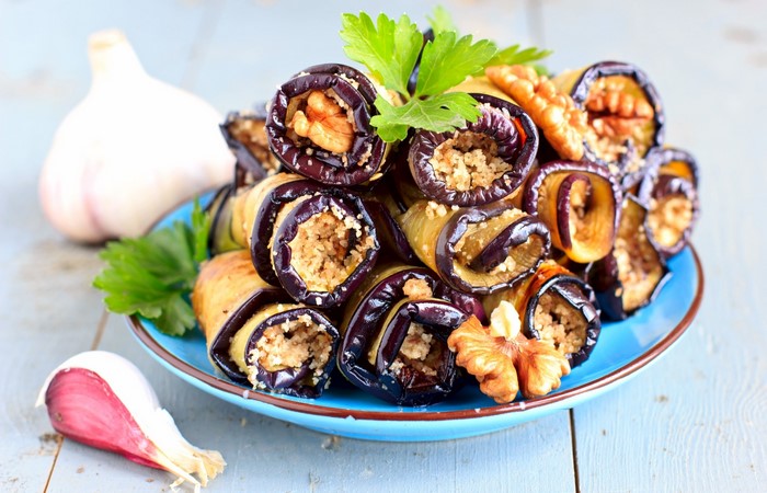Eggplant rolls with walnuts and garlic on a plate