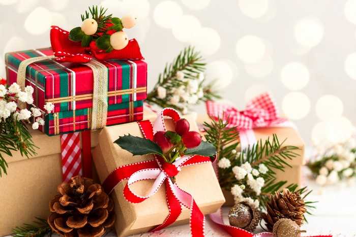 Christmas gifts with pine cones and fir branches