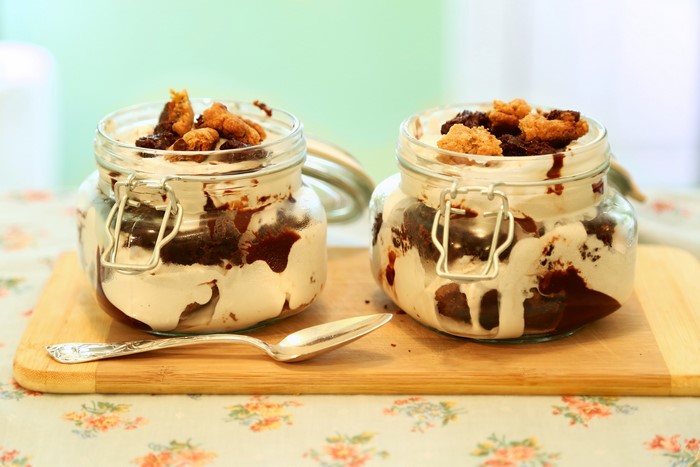 Two desserts in jars with spoon