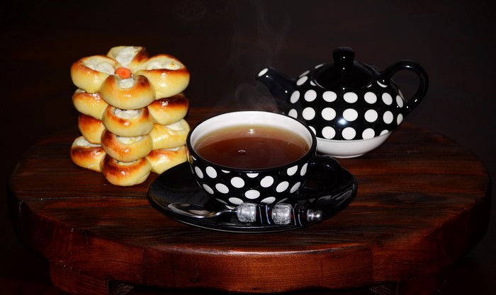 Tea and pastries on a wooden table
