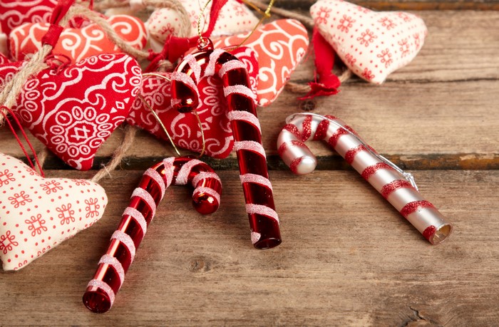 Christmas ornaments and hearts on wood