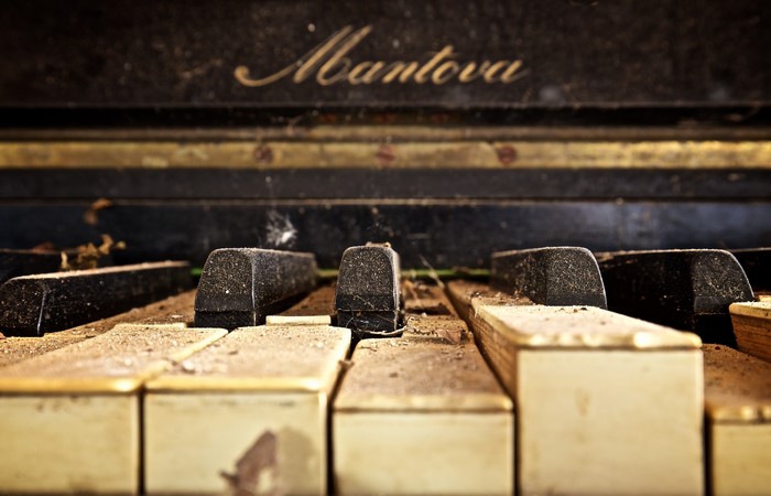 Close-up of dusty old Mantova piano keys