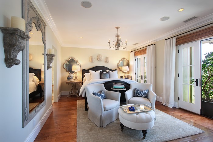 Bedroom with Chandelier, Armchairs, and Bed