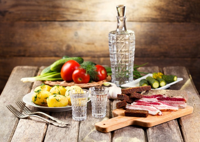 Vodka, Salo, Potatoes, and Vegetables Still Life