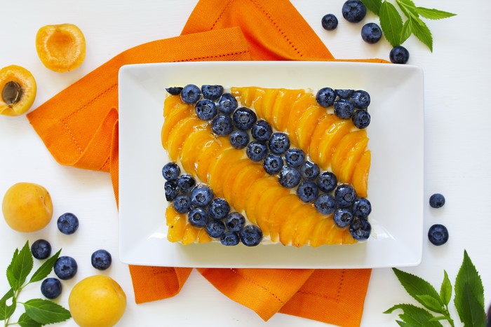 Apricot and Blueberry Tart with Orange Napkin