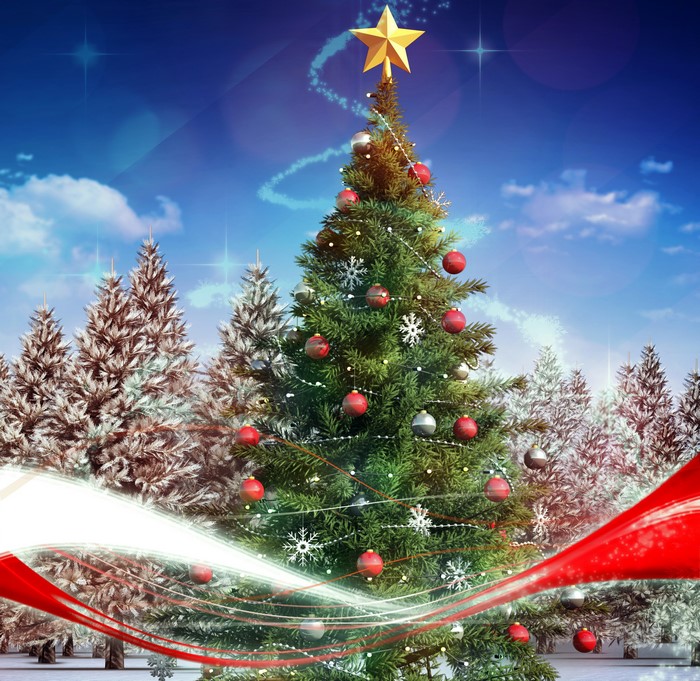 Christmas tree with ornaments and star in snowy forest