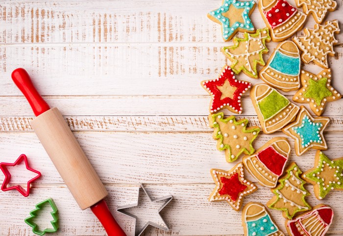 Christmas Cookies and Rolling Pin on White Wood