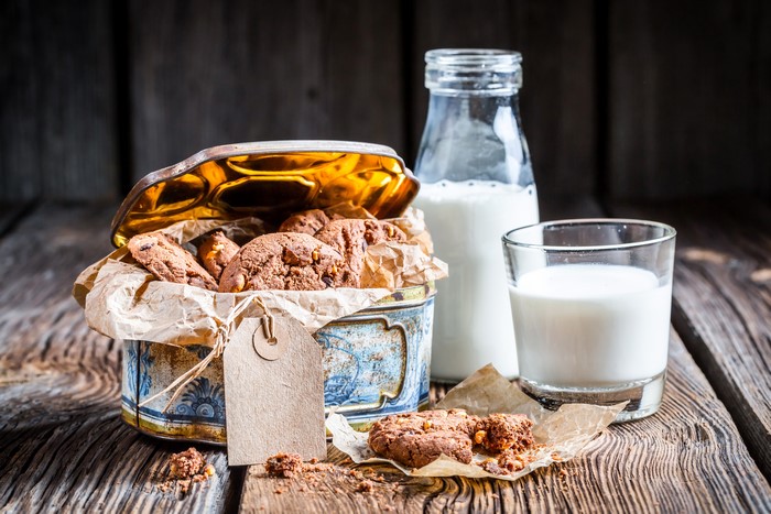 Cookies in a tin box with milk