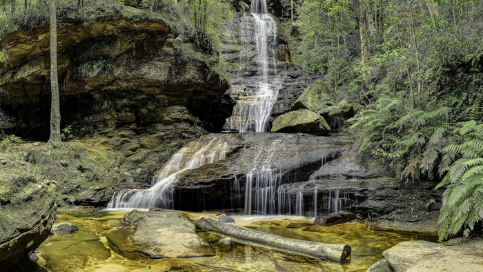 Waterfall cascading over rocks in a forest