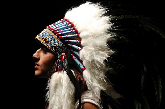 Woman wearing a Native American war bonnet