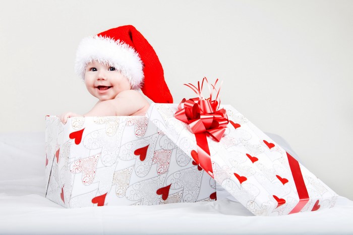Baby in Santa hat in gift box