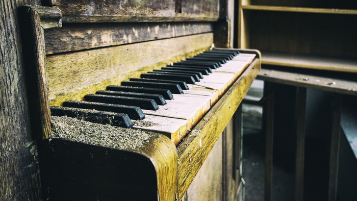 Close-up of an old, dusty piano keyboard