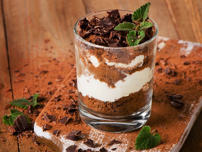 Chocolate dessert with cream and mint in a glass