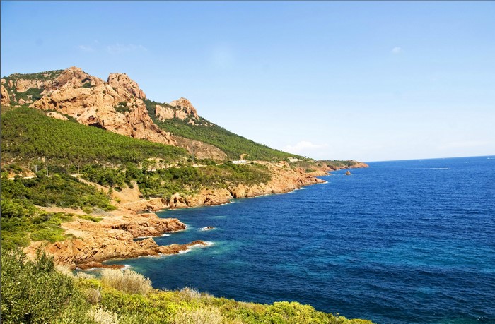Rocky Coastline with Green Hills and Blue Sea in France