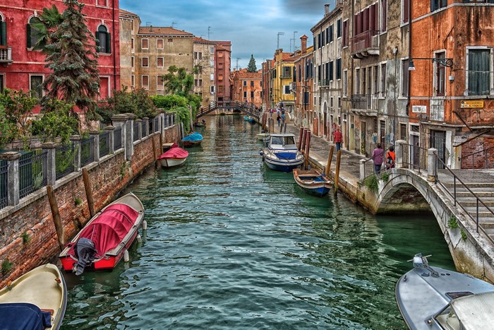Venice canal with boats and bridges