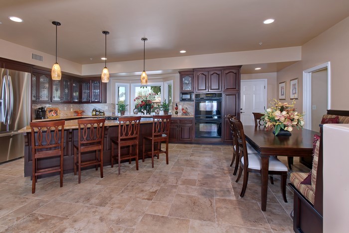 Kitchen with Island, Dining Table, and Chairs