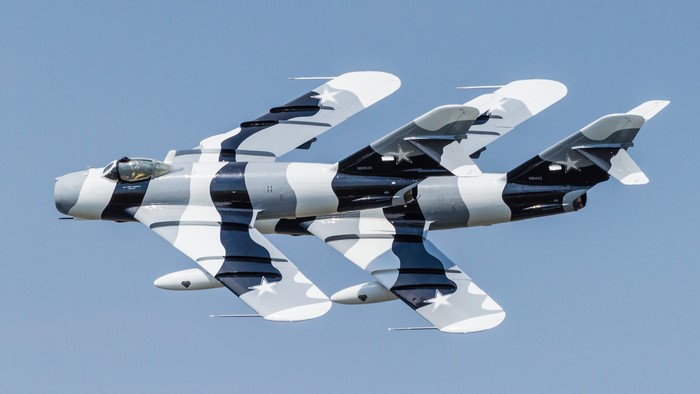 Two Mikoyan-Gurevich MiG-17F fighter airplanes in flight