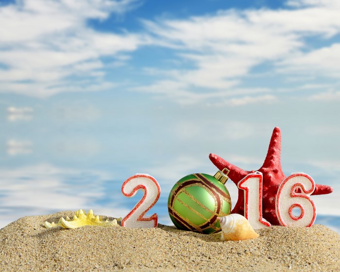 2016 Christmas ornaments on a beach