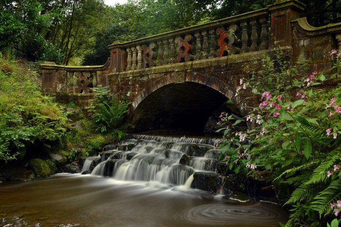 Stone bridge over a waterfall in Darwen, England