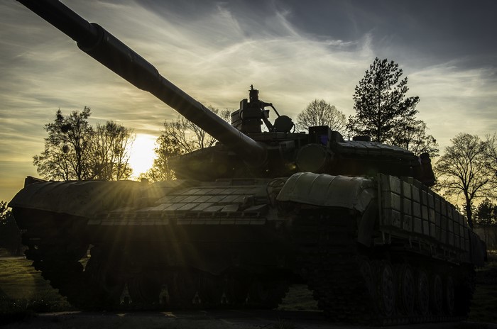 T-72 tank at sunset with sun rays