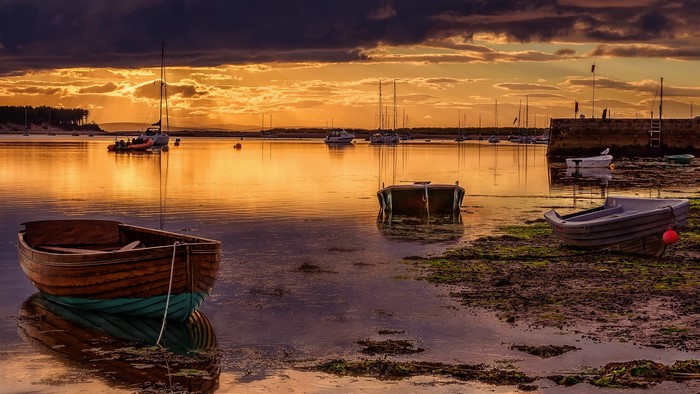 Boats on the water at sunset