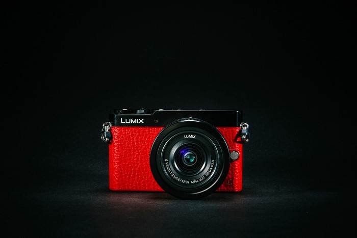 Red Panasonic Lumix GM5 camera with lens