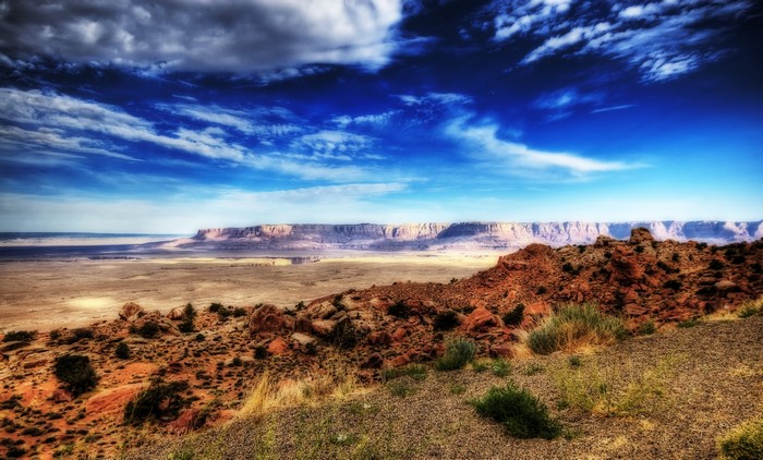 Desert landscape with mesas and dramatic sky in Arizona