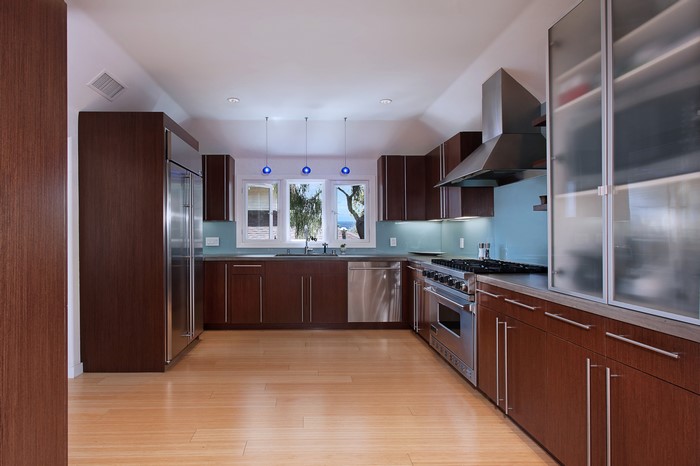 Modern Kitchen with Dark Wood Cabinets and Stainless Steel Appliances