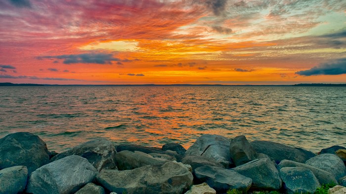 Sunset over the sea with rocks