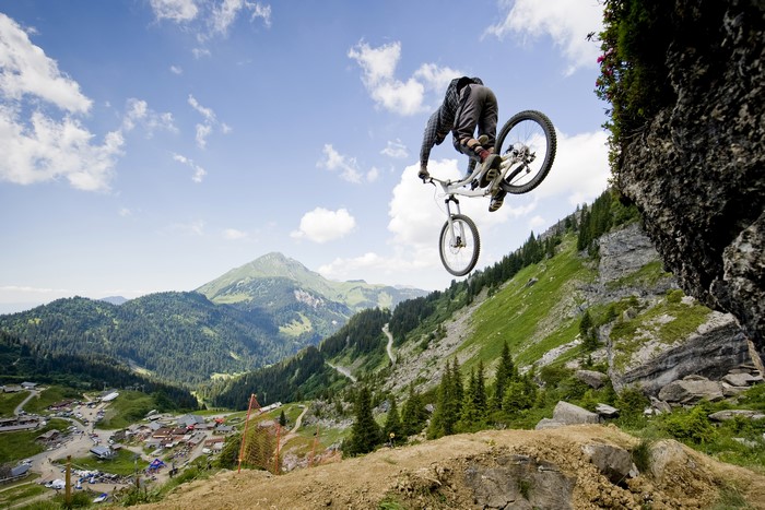 Mountain Biker Jumps Over Cliff