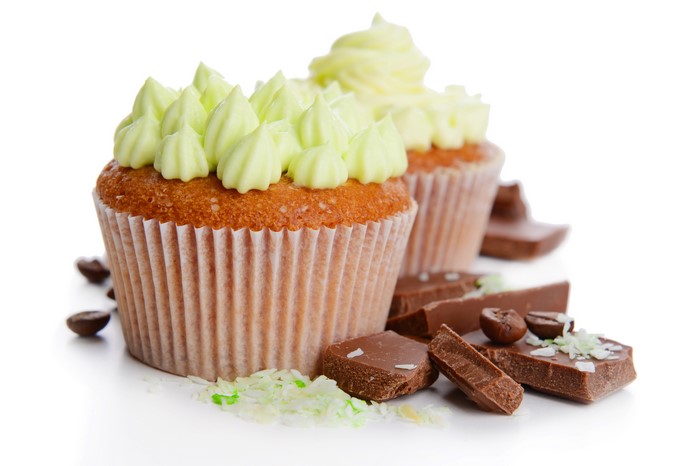 Cupcakes with frosting, chocolate, and coffee beans