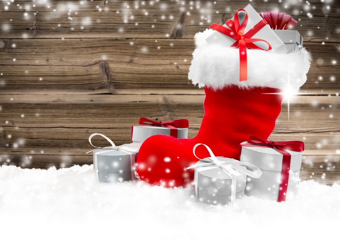 Christmas stocking filled with gifts in the snow