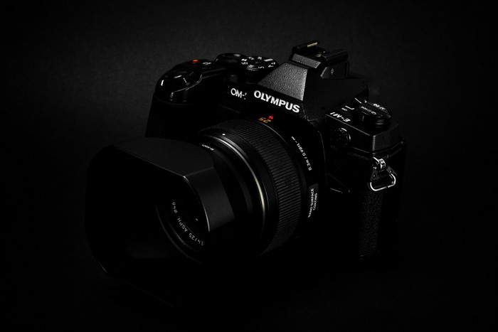Olympus OM-D E-M1 Mark III camera with lens