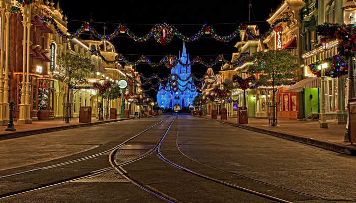 Main Street USA at Disneyland decorated for Christmas at night