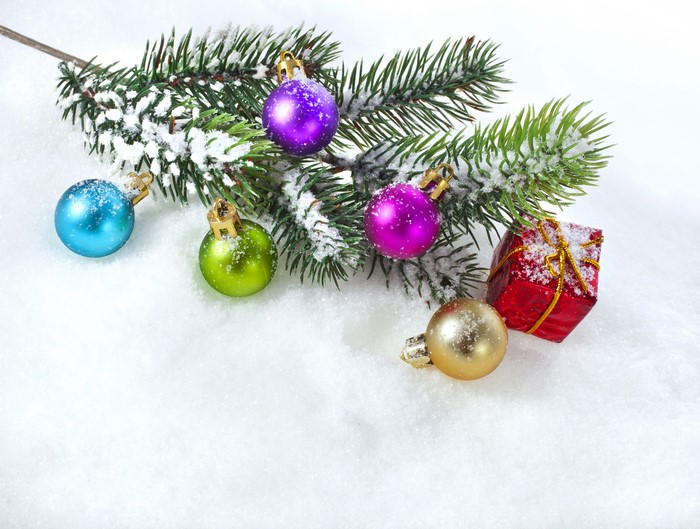 Christmas Ornaments on Snowy Pine Branch