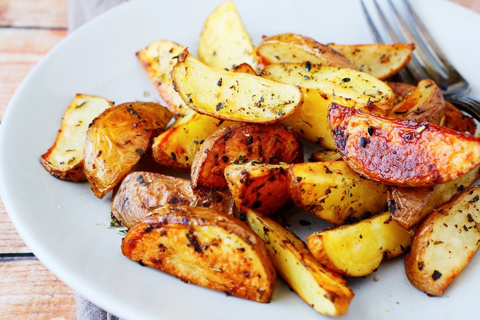 Roasted potato wedges on a plate