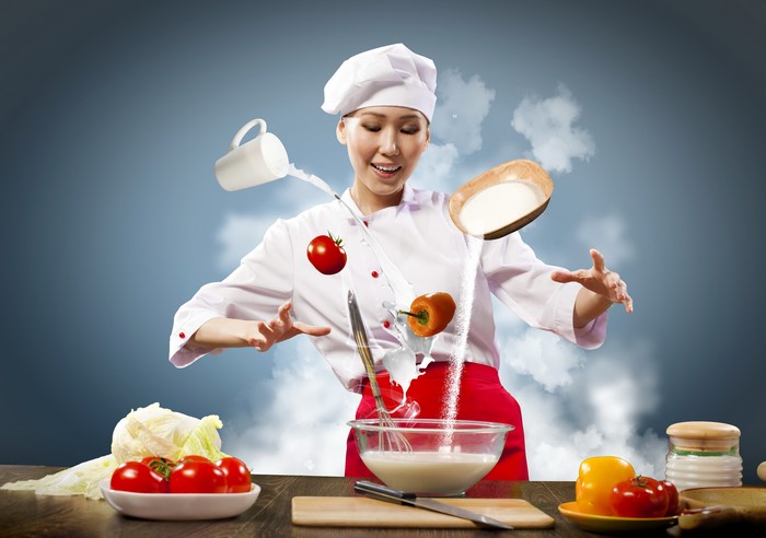 Chef cooking with floating ingredients