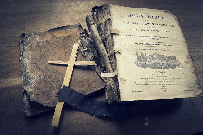 Old Holy Bible and Wooden Cross