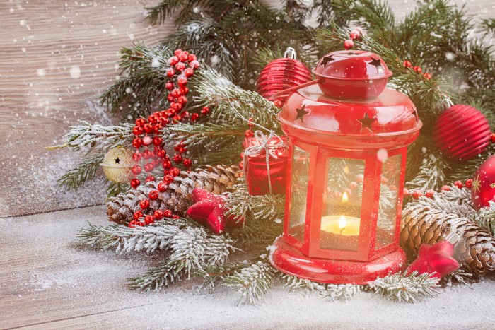 Christmas lantern with pine cones and snow