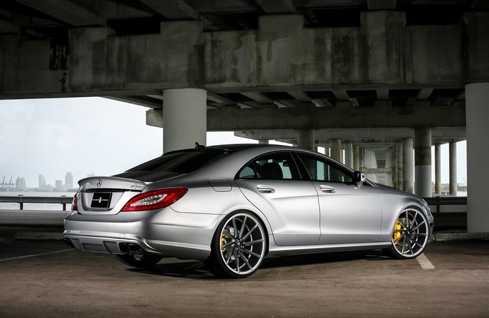 Silver Mercedes-Benz CLS parked under a bridge