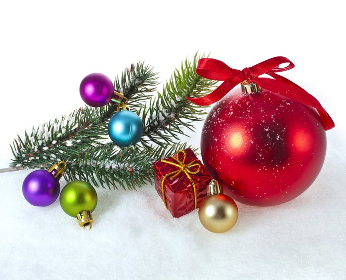 Christmas Ornaments on Snowy Pine Branch with Red Bow