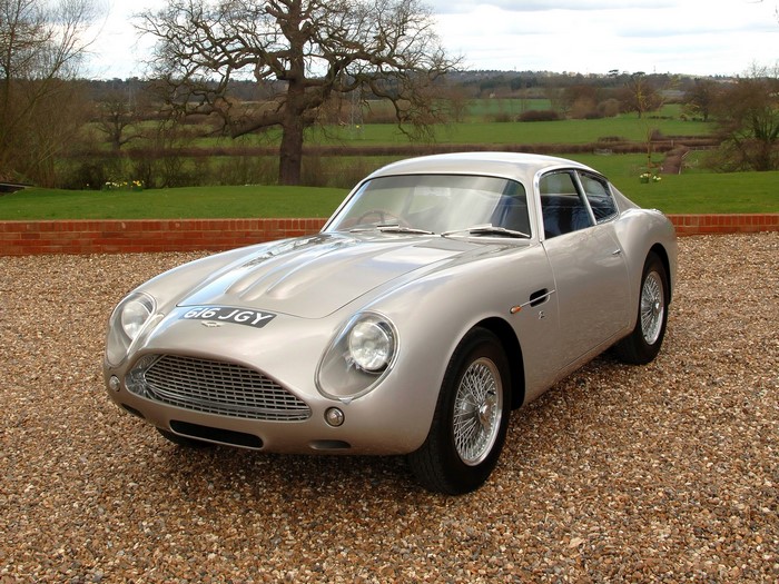 Silver Aston Martin DB5 parked on gravel